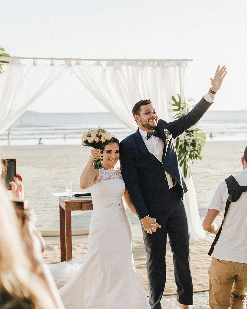 Couple by the beach, waves washing onto shore