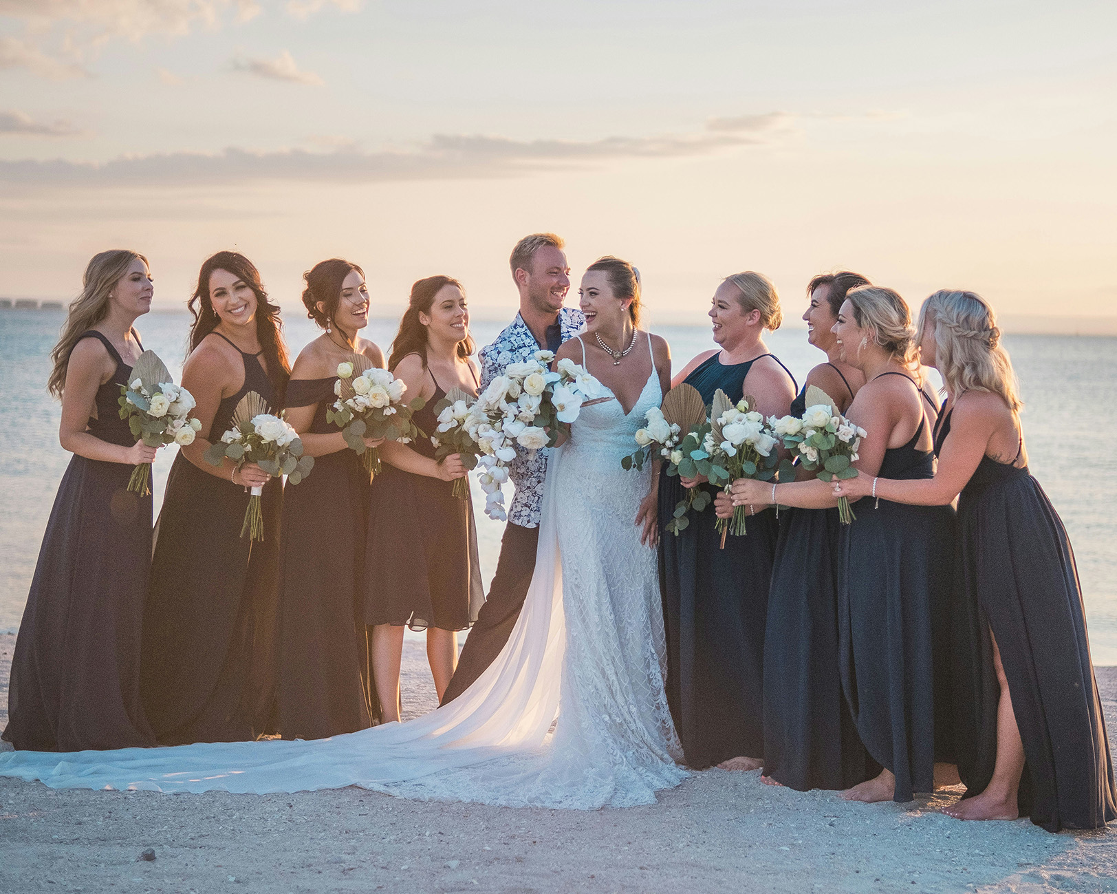 Couple by the beach, waves washing onto shore