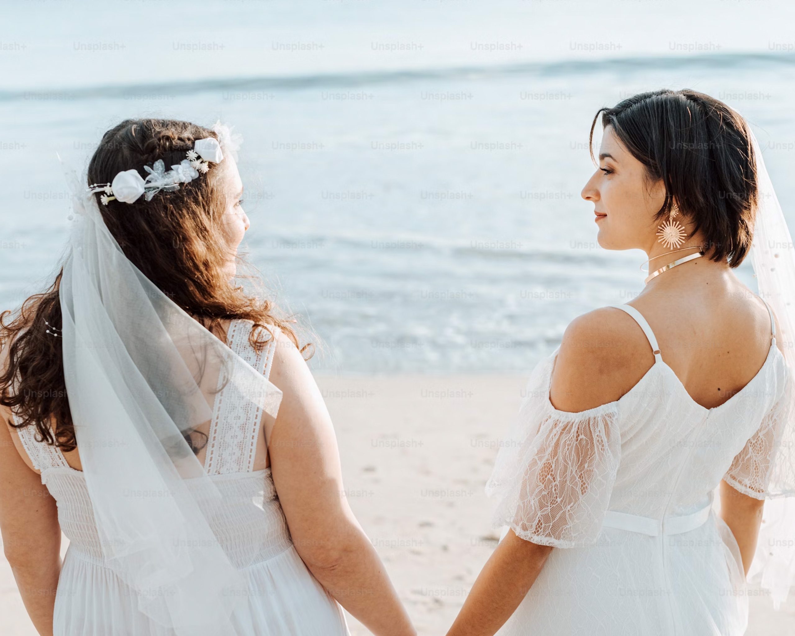 Couple by the beach, waves washing onto shore